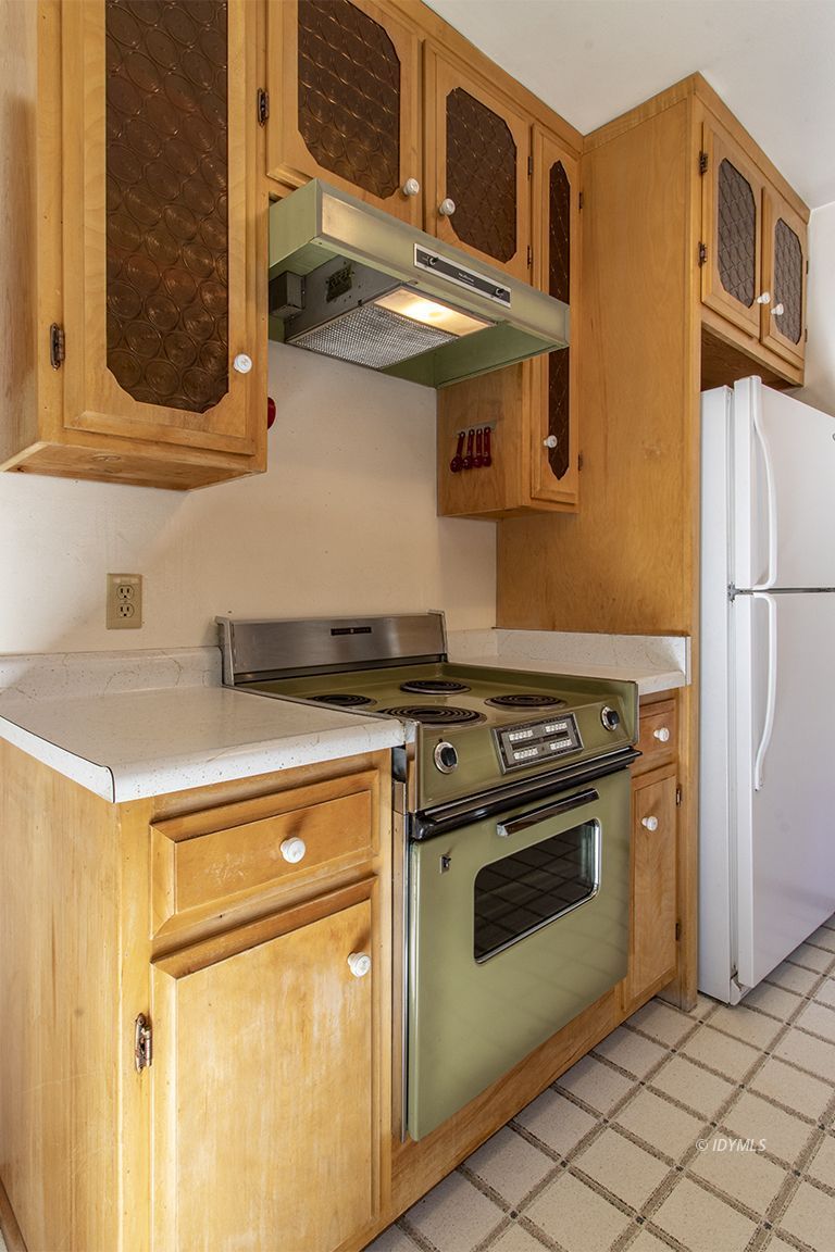 25230 Glen Road Idyllwild, CA 92549 - Photo 16 of 57 a kitchen with stainless steel appliances granite countertop a stove and a refrigerator