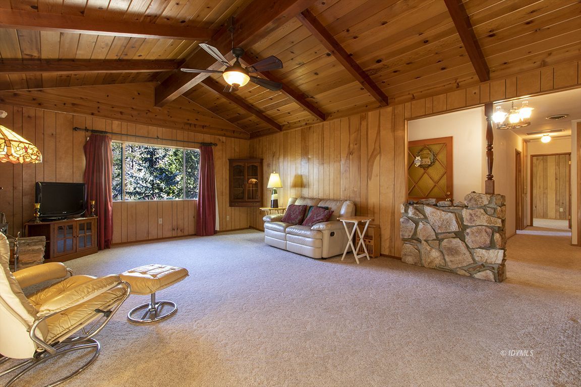 25230 Glen Road Idyllwild, CA 92549 - Photo 5 of 57 a living room with furniture and a flat screen tv