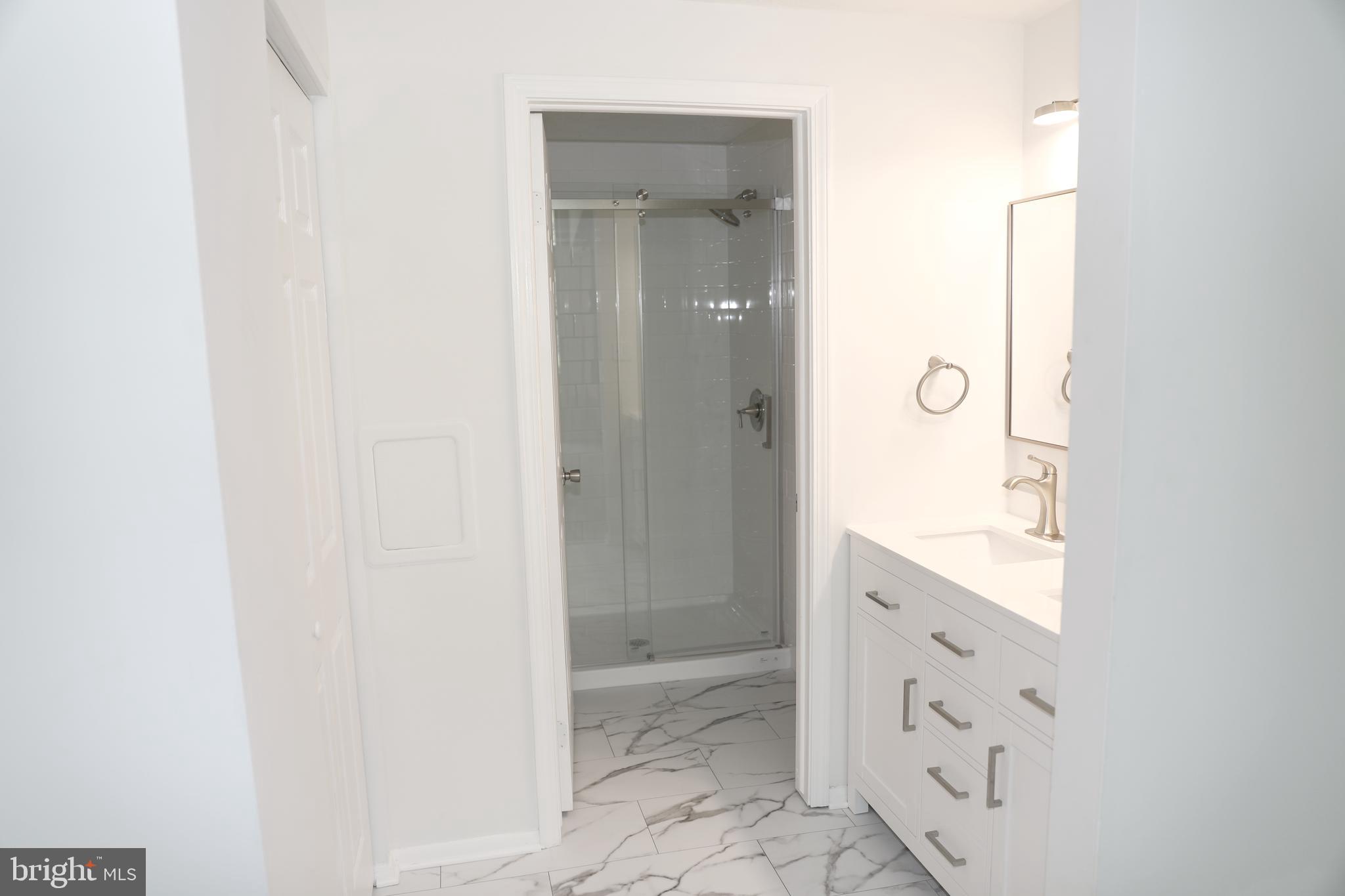 8106 Triple Crown Road Bowie, MD 20715 - Photo 12 of 21 a bathroom with a granite countertop sink and a mirror