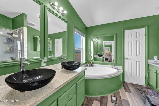 a view of a lake with beach and city view