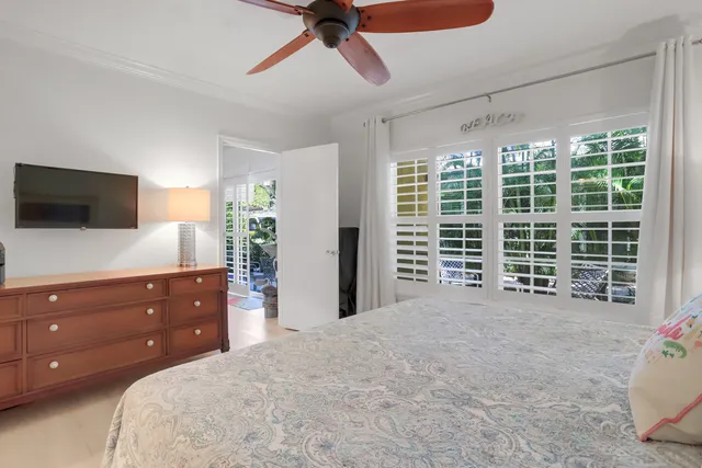 a bed room with a bed and a television