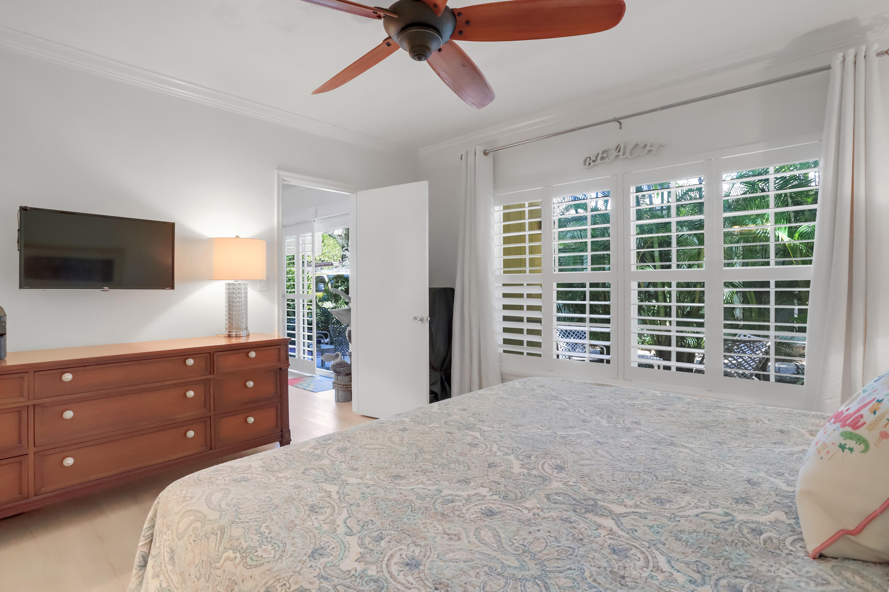 217 Gleason Street, Unit A Delray Beach, FL 33483 - Photo 11 of 28 a bed room with a bed and a television