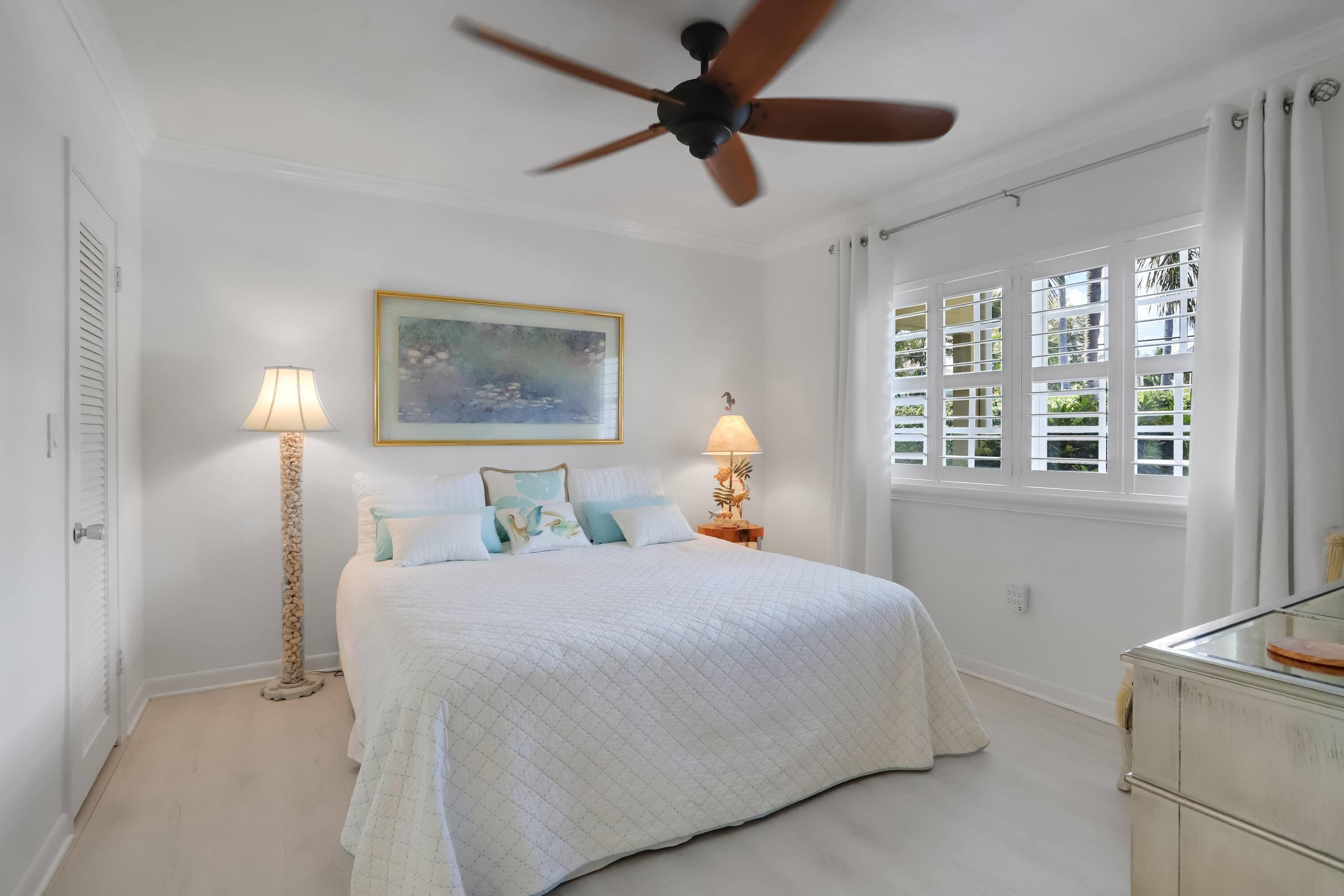 217 Gleason Street, Unit A Delray Beach, FL 33483 - Photo 14 of 28 a bedroom with a bed and a window