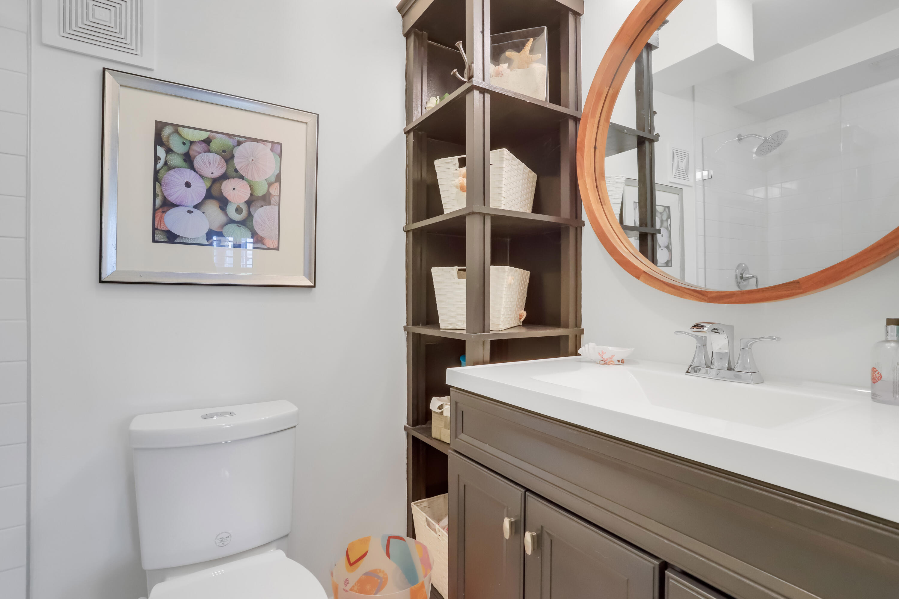 217 Gleason Street, Unit A Delray Beach, FL 33483 - Photo 16 of 28 a bathroom with a toilet sink and mirror