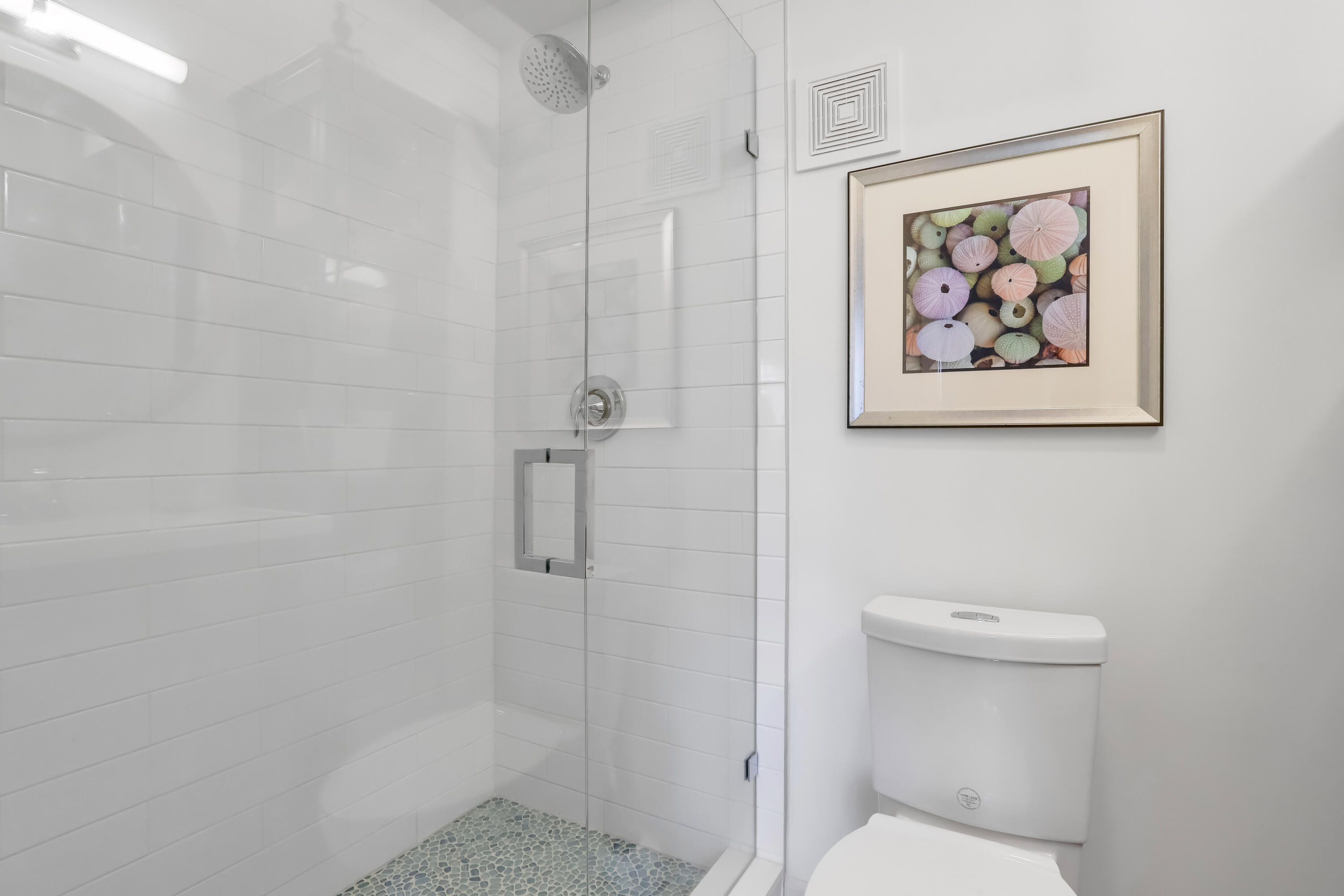 217 Gleason Street, Unit A Delray Beach, FL 33483 - Photo 17 of 28 a bathroom with a toilet and a shower