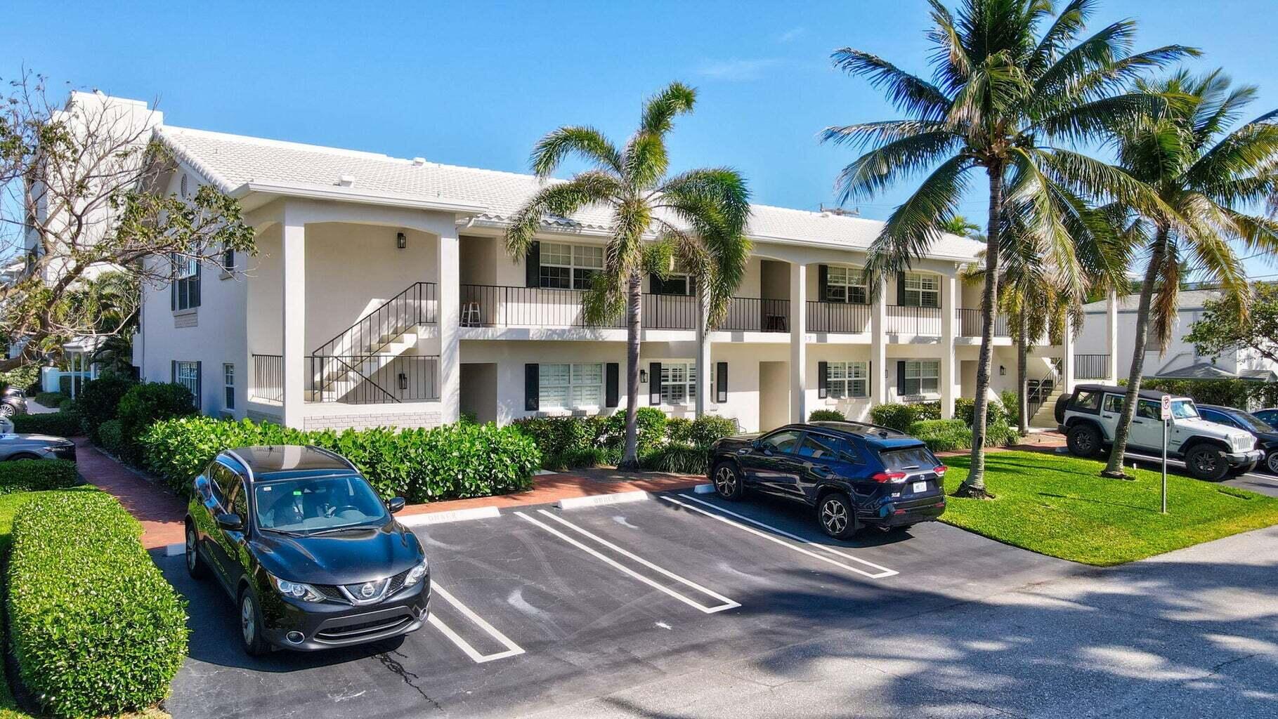 217 Gleason Street, Unit A Delray Beach, FL 33483 - Photo 2 of 28 a car parked in front of a brick house with a yard
