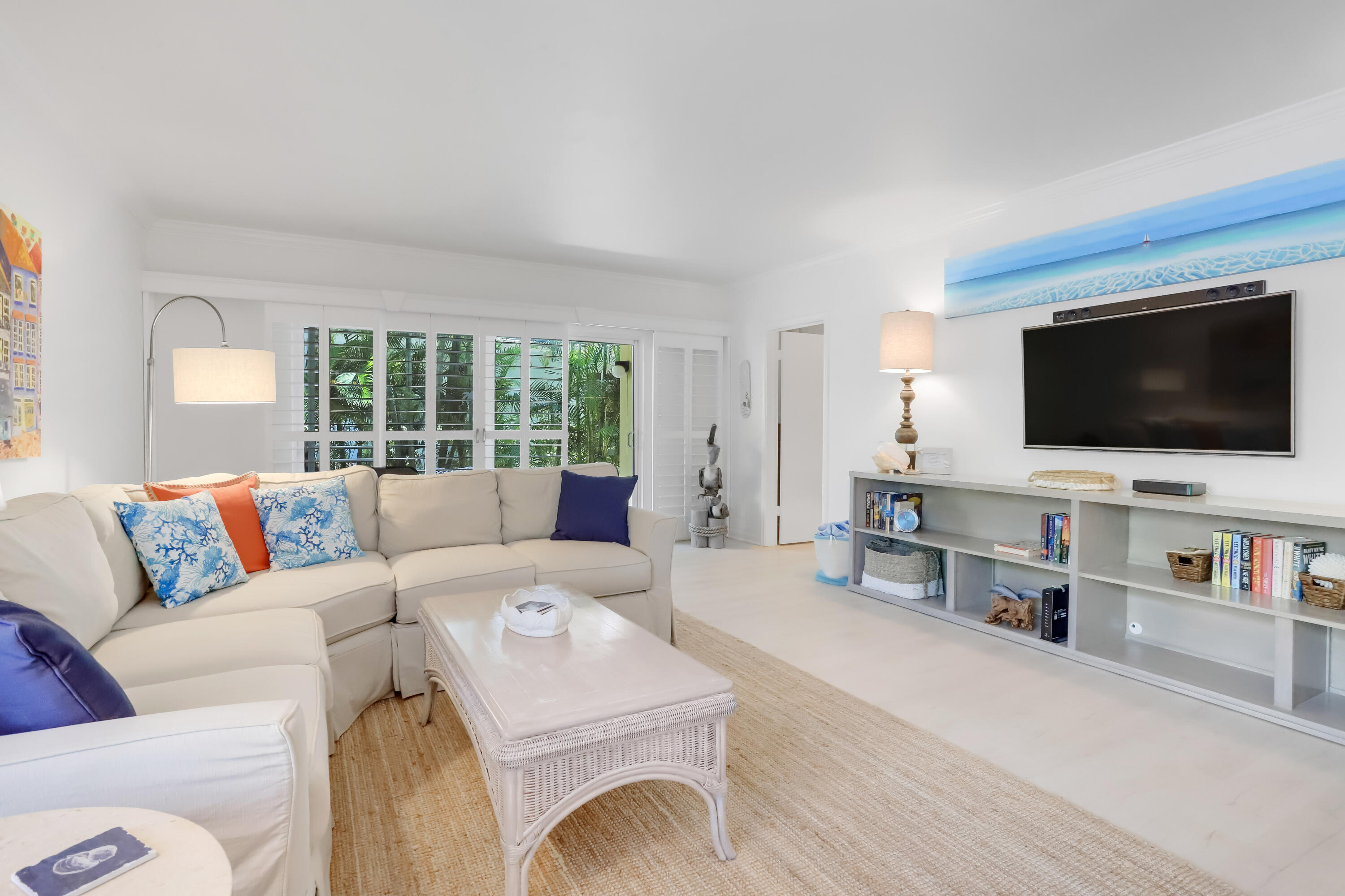 217 Gleason Street, Unit A Delray Beach, FL 33483 - Photo 6 of 28 a living room with furniture and a flat screen tv