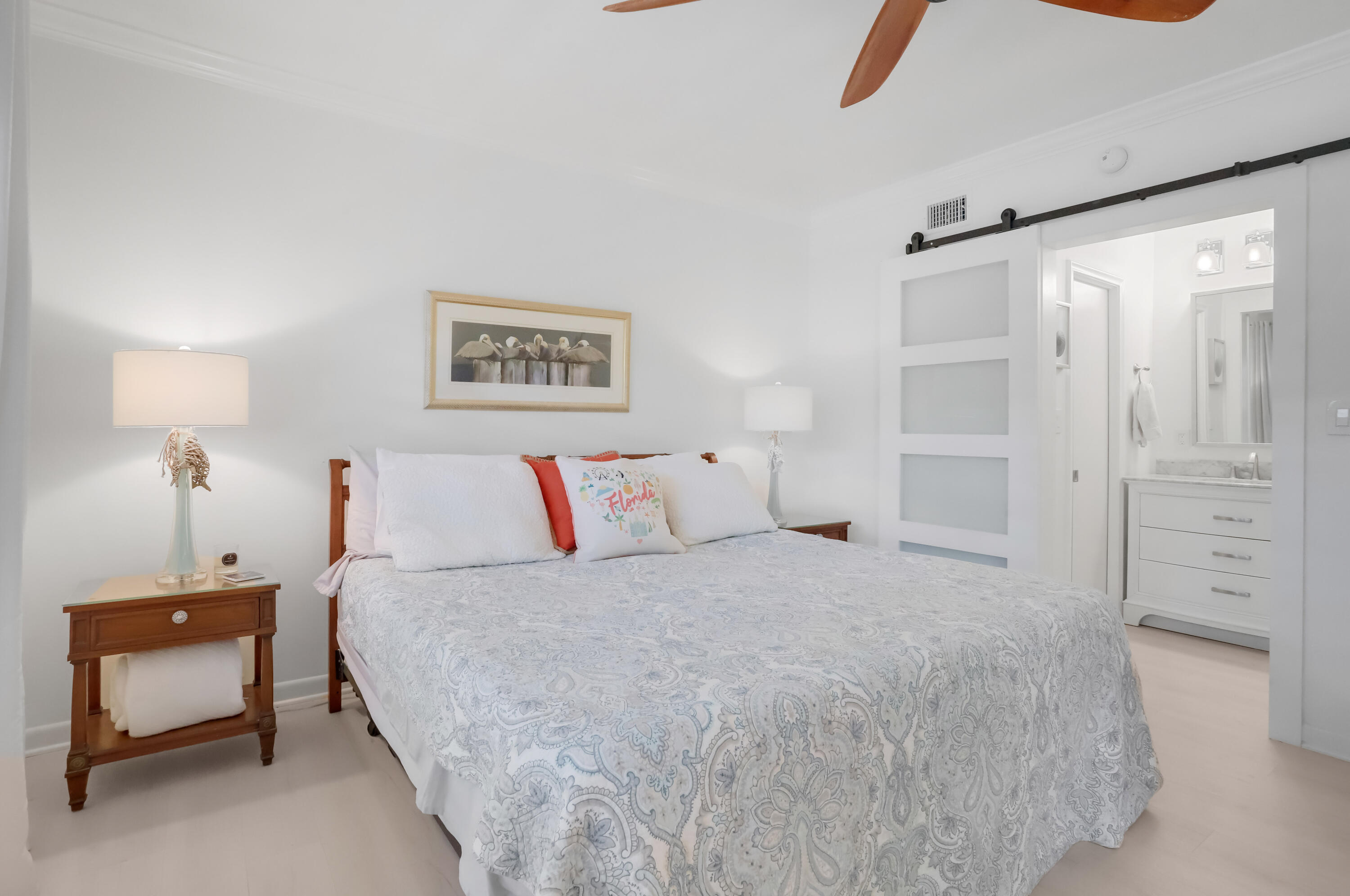 217 Gleason Street, Unit A Delray Beach, FL 33483 - Photo 10 of 28 a bedroom with a bed and a window