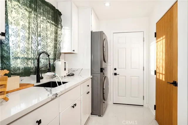a kitchen with a sink and a refrigerator
