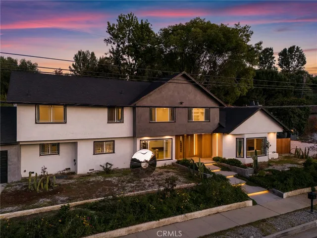 a front view of a house with yard