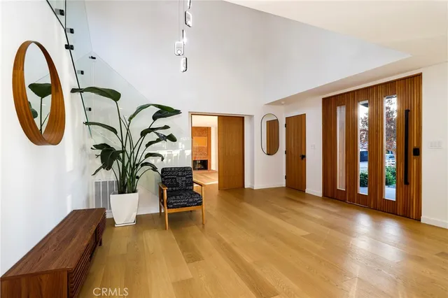 a view of a livingroom with furniture and staircase