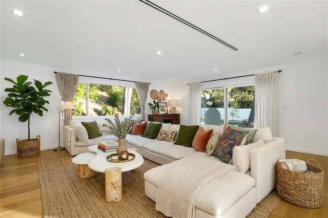 a living room with furniture and a large window