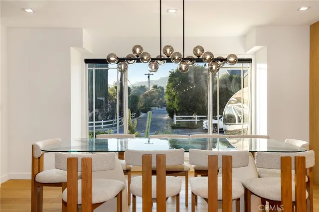 a view of dinning table and chairs