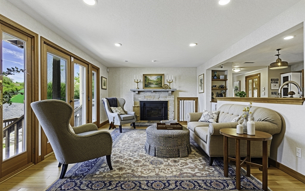 28 Downey Street Hopkinton, MA 01748 - Photo 13 of 39 a living room with furniture fireplace and a large window