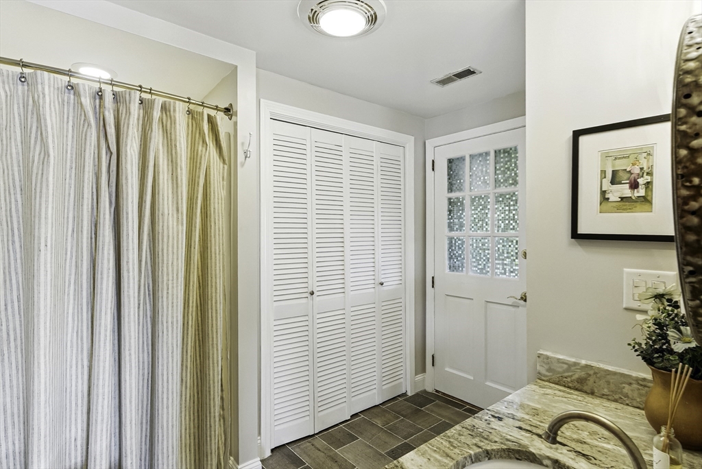 28 Downey Street Hopkinton, MA 01748 - Photo 15 of 39 a bedroom with a bed and a window