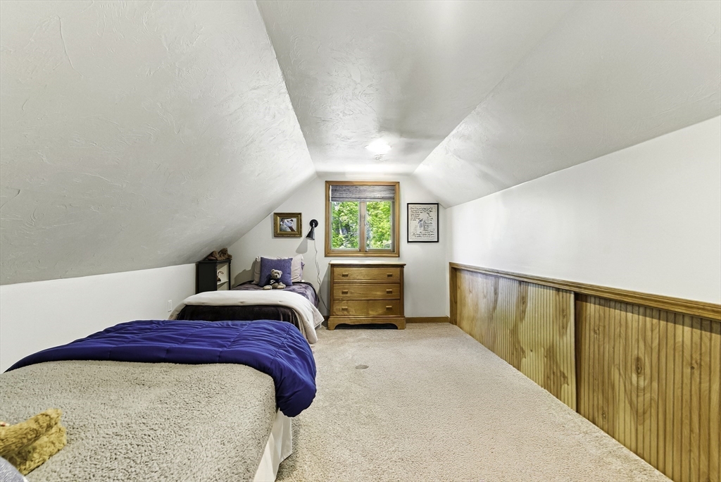 28 Downey Street Hopkinton, MA 01748 - Photo 22 of 39 a bedroom with a bed and a large window