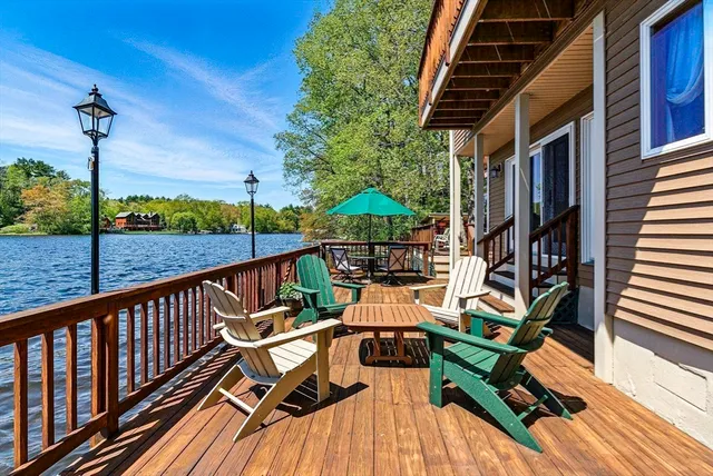 a view of a chairs and table on the deck