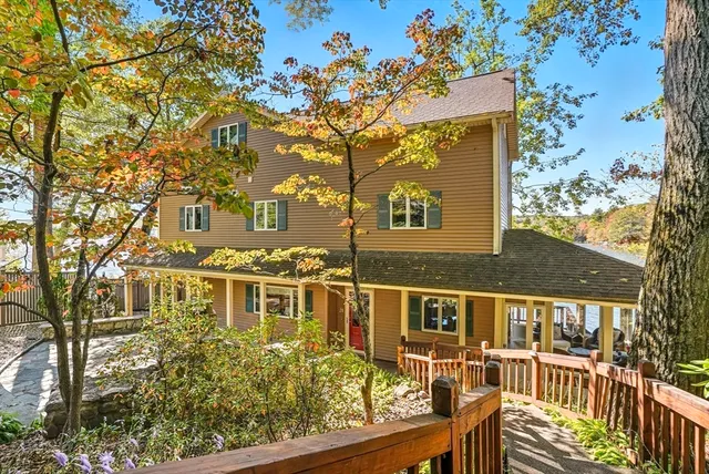 a backyard of a house with outdoor seating