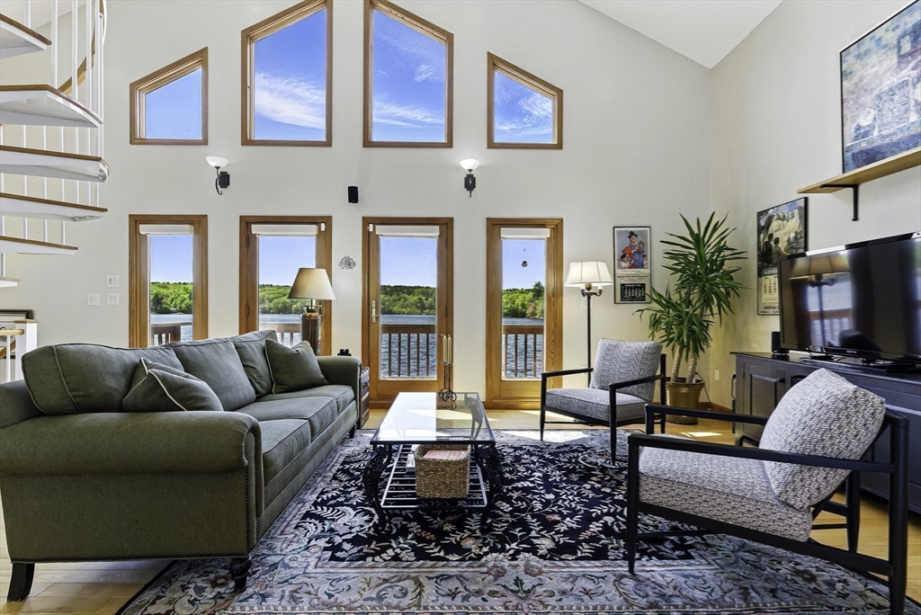 28 Downey Street Hopkinton, MA 01748 - Photo 6 of 39 a living room with furniture fireplace and flat screen tv