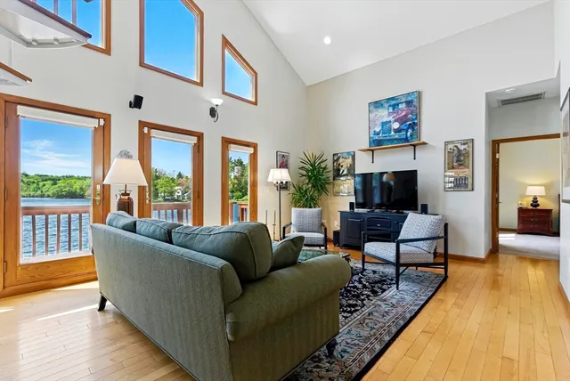a living room with furniture rug and a table