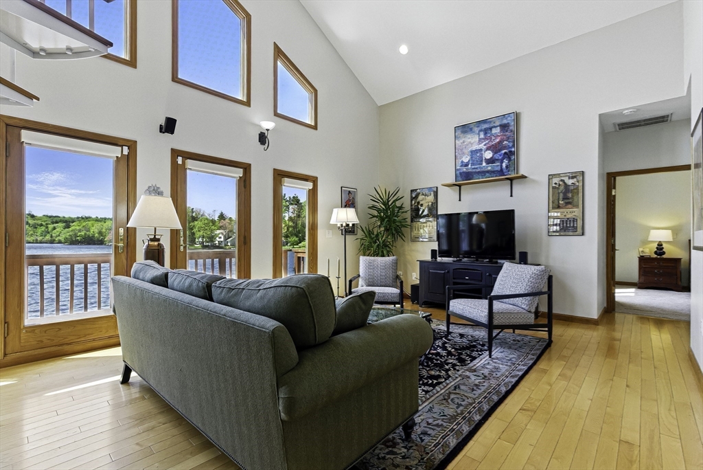 28 Downey Street Hopkinton, MA 01748 - Photo 7 of 39 a living room with furniture fireplace and a large window