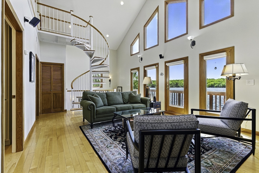 28 Downey Street Hopkinton, MA 01748 - Photo 8 of 39 a living room with furniture rug and a table
