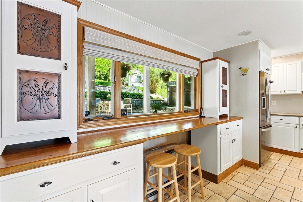 28 Downey Street Hopkinton, MA 01748 - Photo 10 of 39 a large white kitchen with a large window