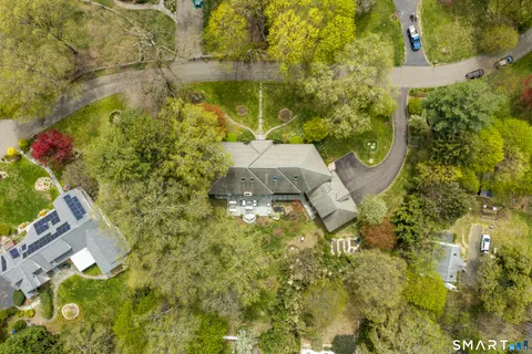 a aerial view of a residential apartment building with swimming pool