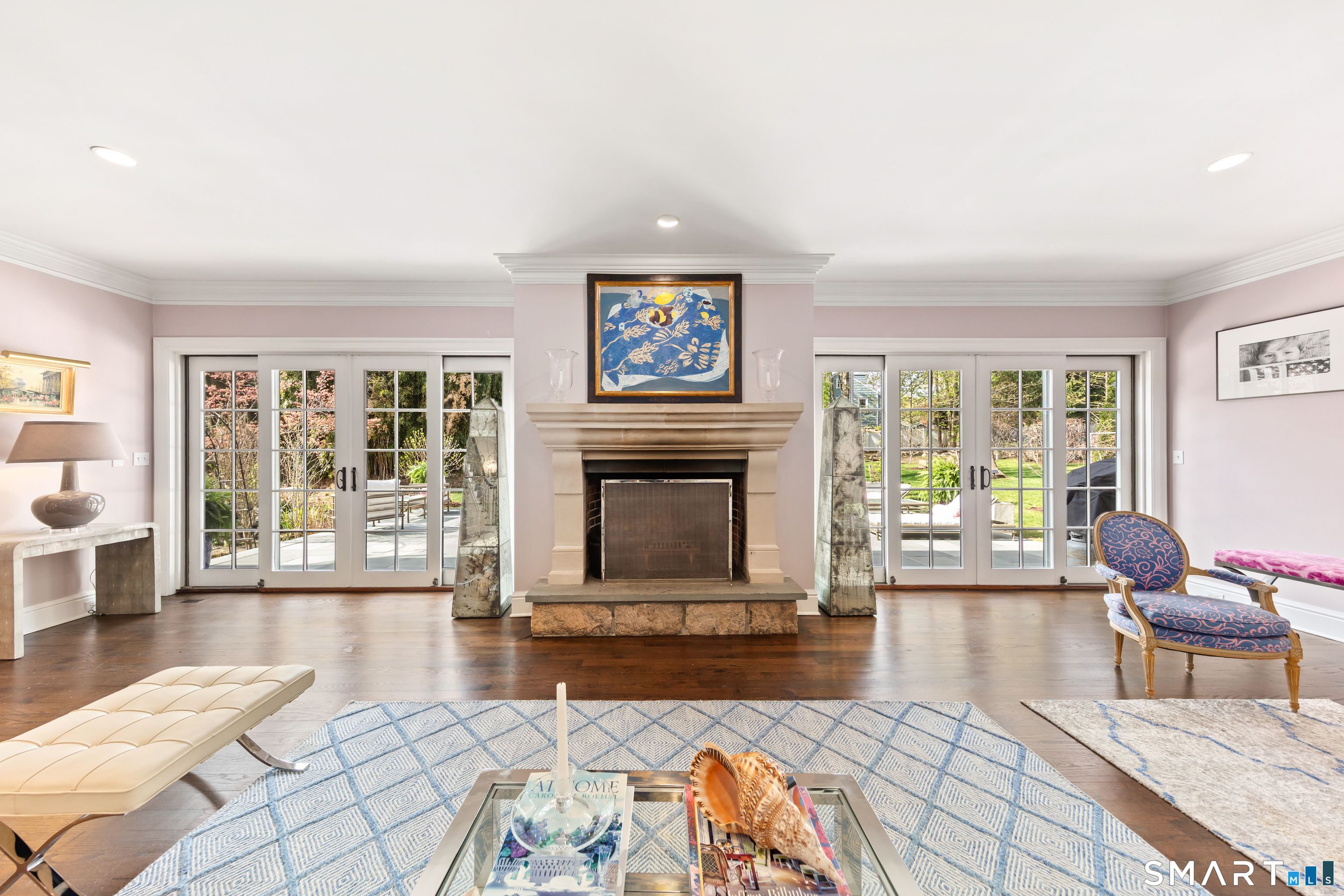 22 Cavray Road Norwalk, CT 06855 - Photo 5 of 40 Formal Living Room with fireplace and two sets of sliding doors leading to the back patio