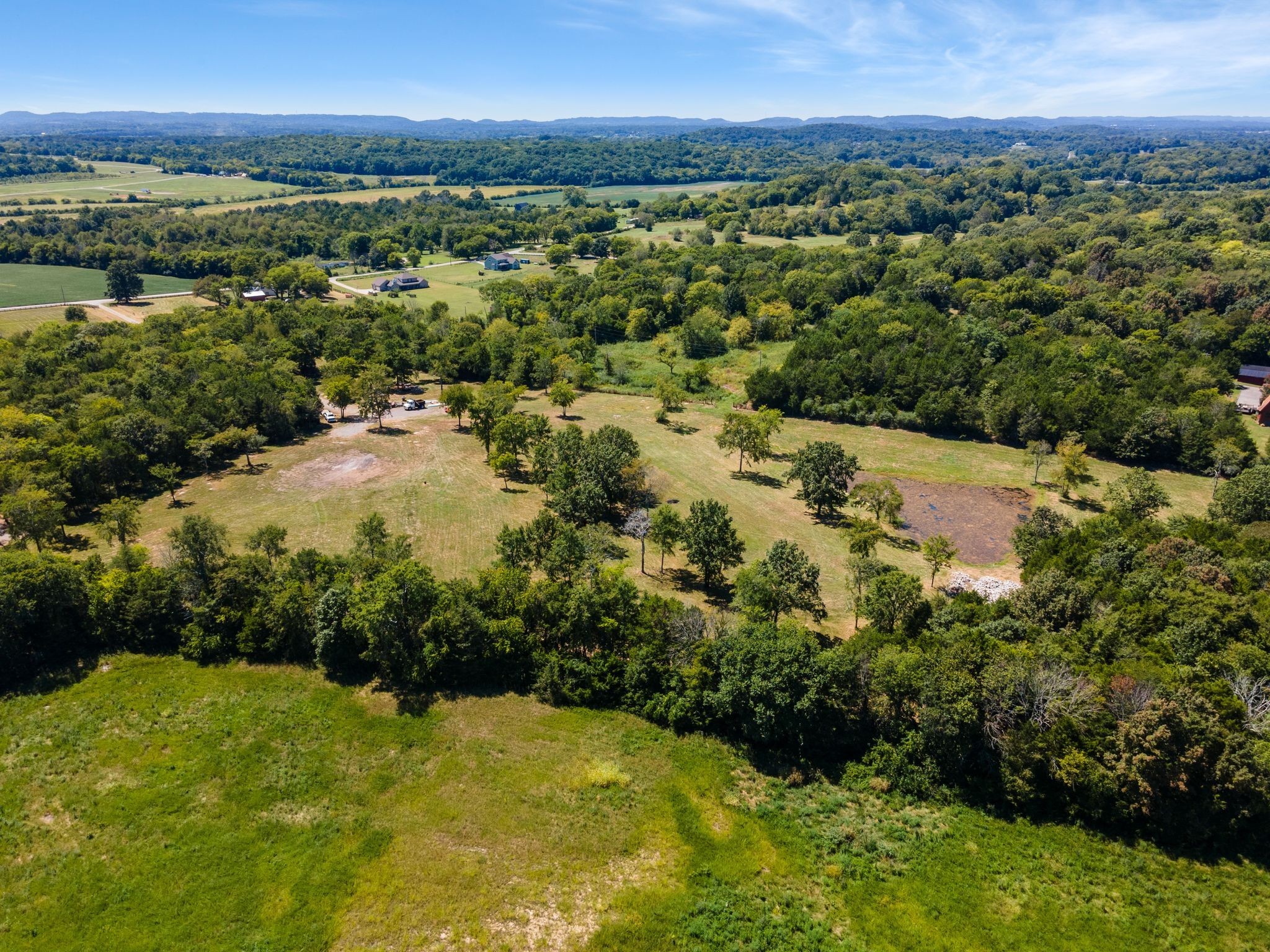 8362 Patterson Road College Grove, TN 37046 - Photo 20 of 27 a view of a city with lush green forest
