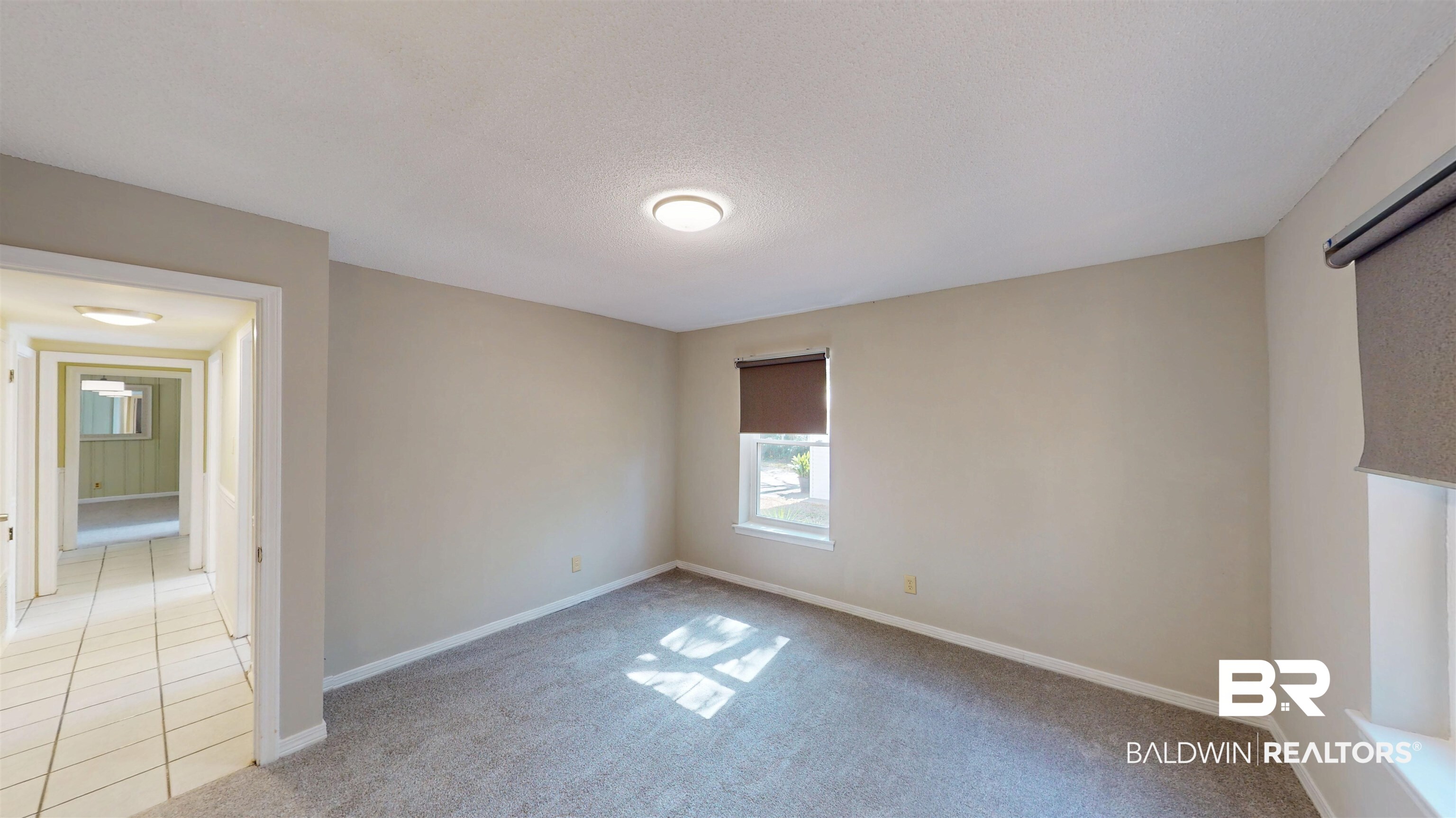 1471 Cedar Crescent Drive Mobile, AL 36605 - Photo 20 of 28 Carpeted empty room featuring baseboards and a textured ceiling