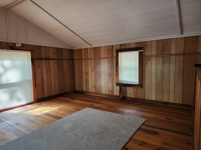 a view of a room with a wooden door