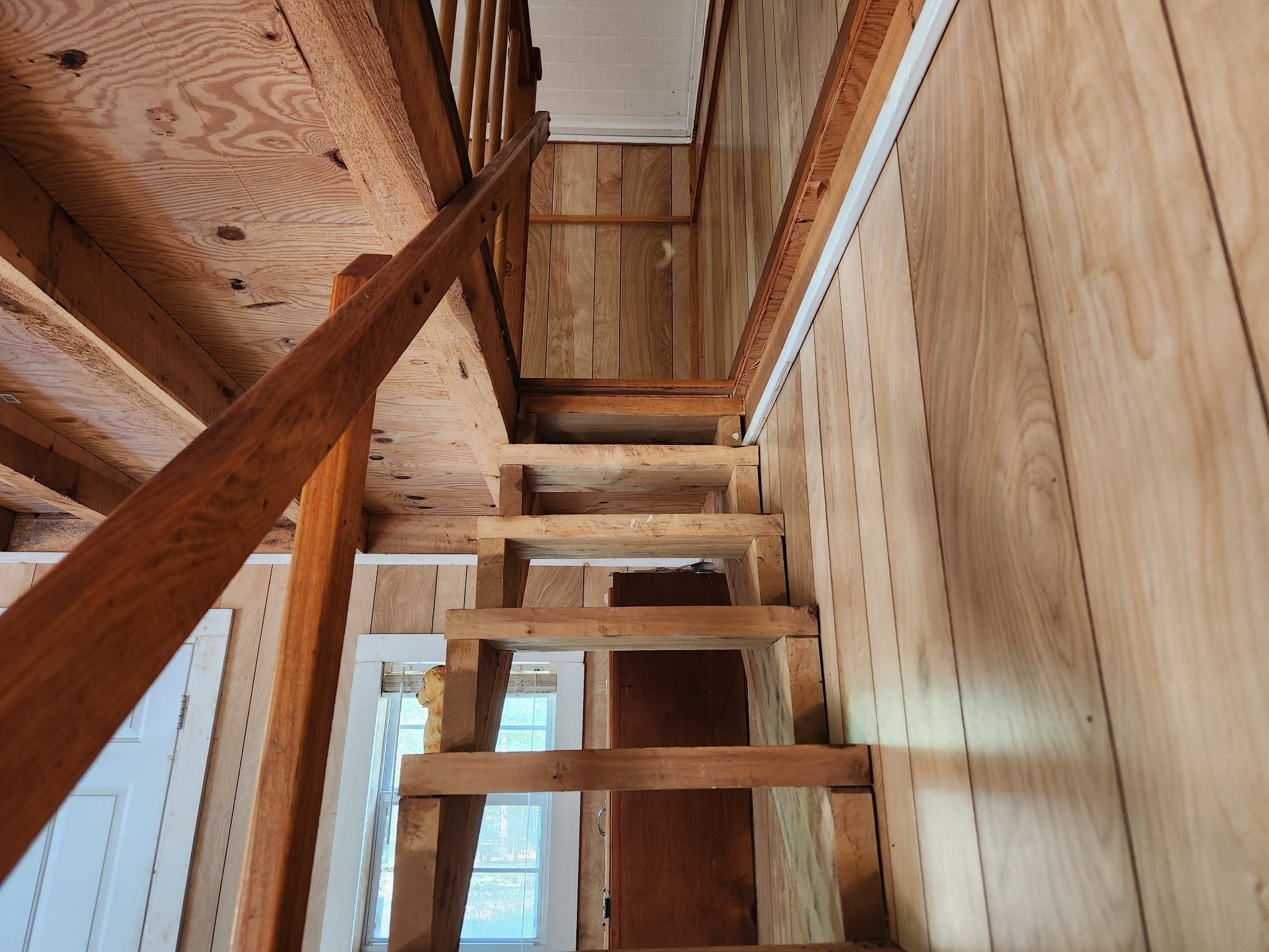 138 Vaughn Road Charlotte, TN 37036 - Photo 9 of 22 a view of staircase with wooden floor and white walls