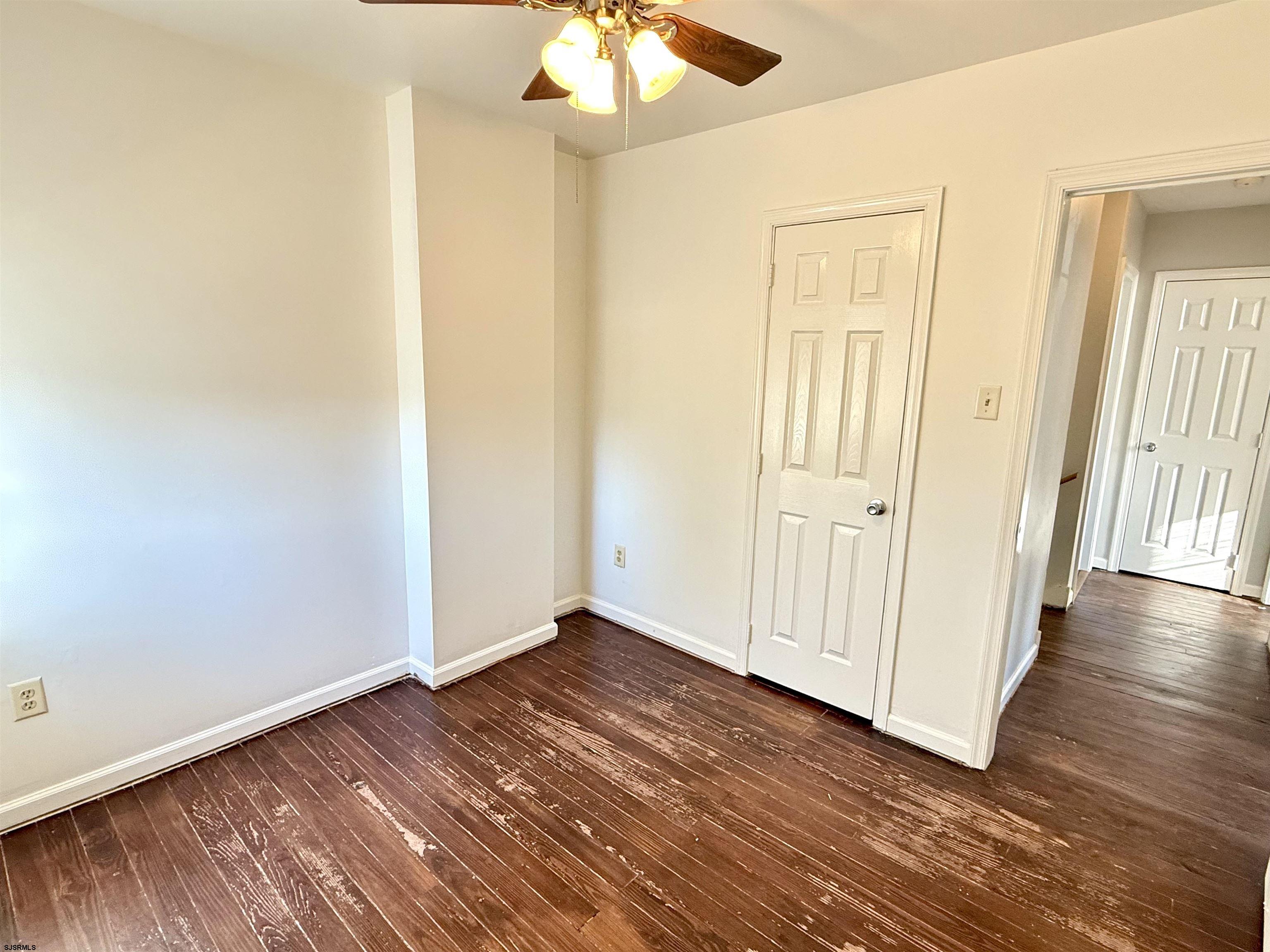 1309 Matthews Avenue, Unit B Mays Landing, NJ 08330 - Photo 12 of 19 wooden floor in an empty room with a window