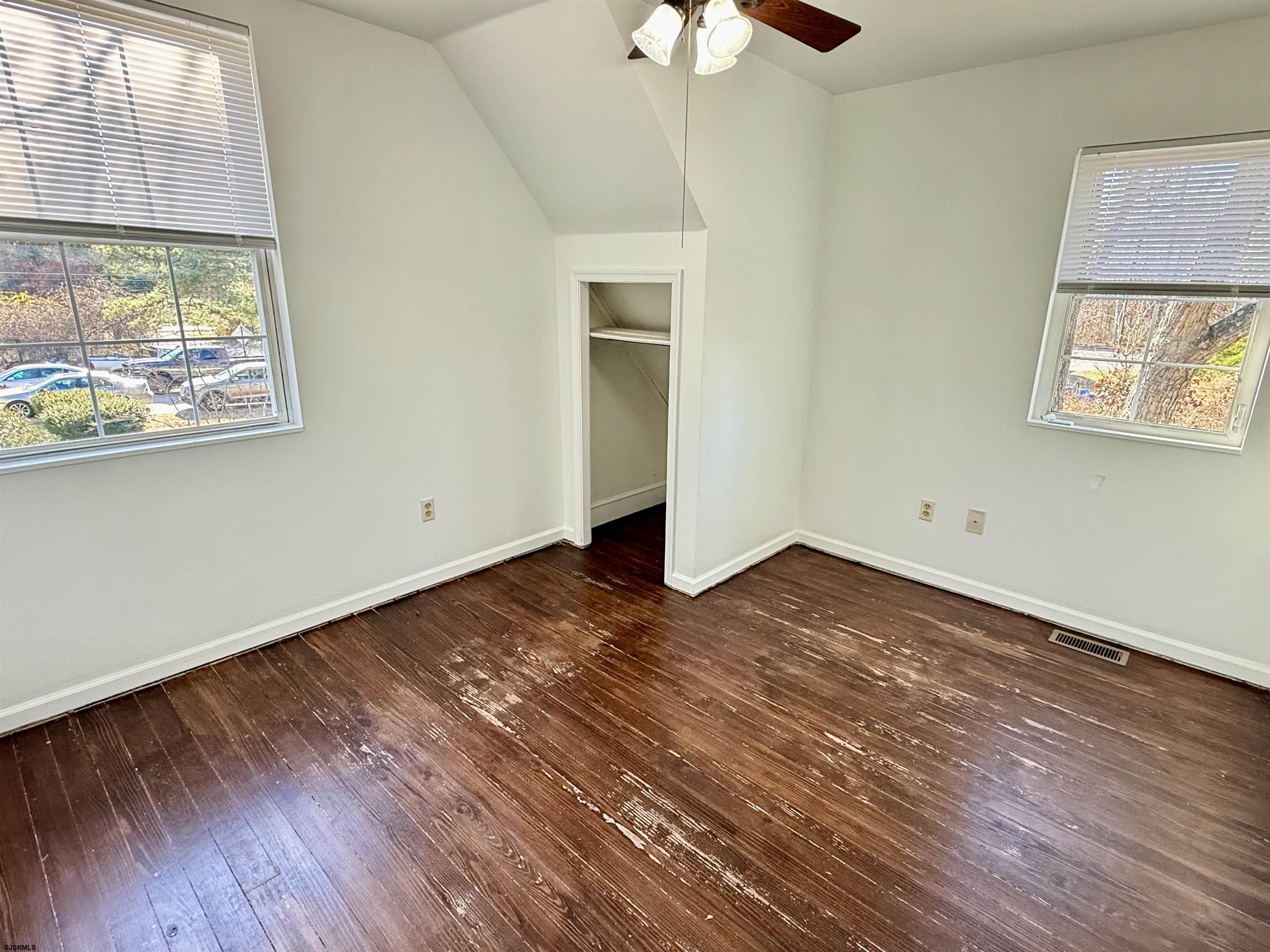 1309 Matthews Avenue, Unit B Mays Landing, NJ 08330 - Photo 13 of 19 a view of empty room with wooden floor and fan