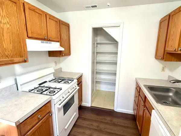 a kitchen with a stove and a sink