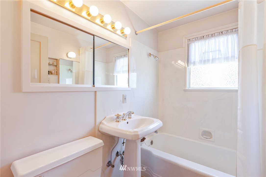 464 Bronson Way Northeast Renton, WA 98056 - Photo 14 of 25 a bathroom with a sink toilet and shower