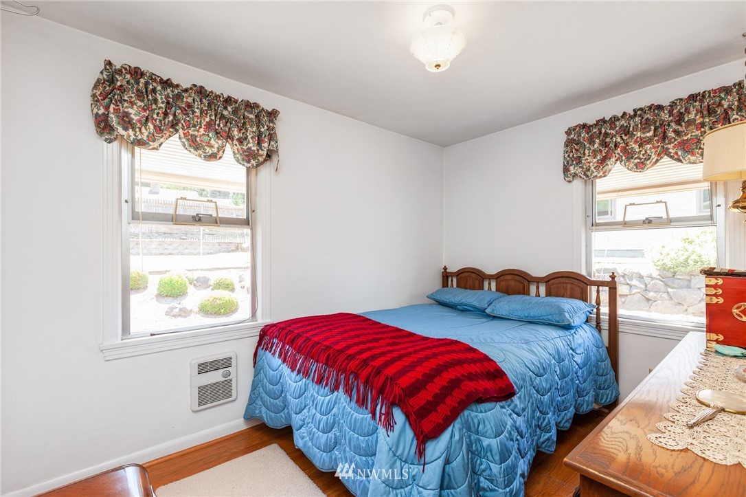 464 Bronson Way Northeast Renton, WA 98056 - Photo 15 of 25 a bedroom with a bed and a window