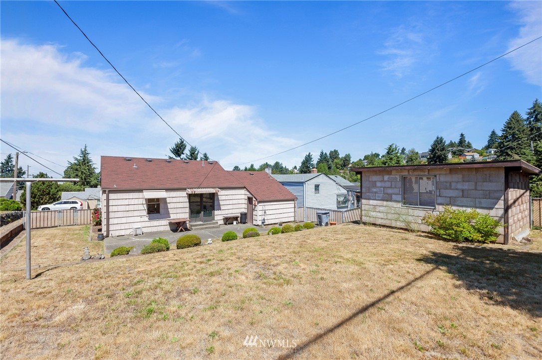 464 Bronson Way Northeast Renton, WA 98056 - Photo 19 of 25 a view of a house with a patio