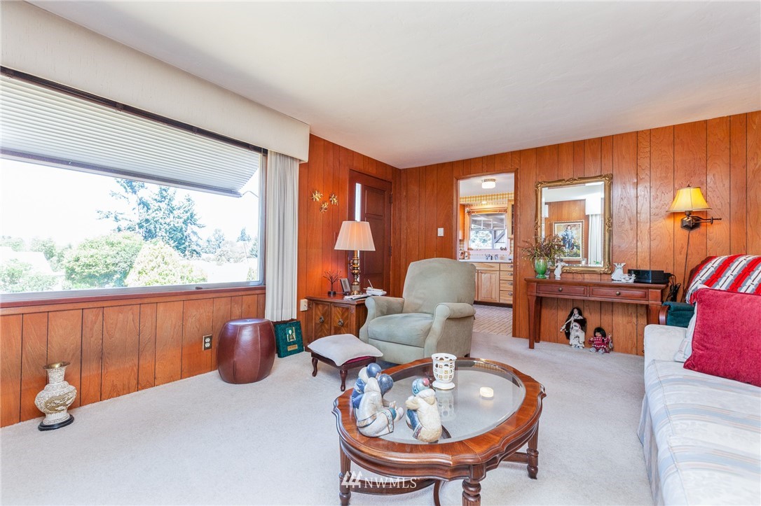 464 Bronson Way Northeast Renton, WA 98056 - Photo 3 of 25 a living room with furniture and a large window