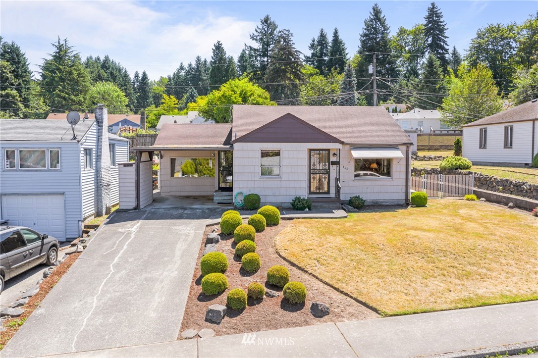 464 Bronson Way Northeast Renton, WA 98056 - Photo 21 of 25 a view of a house with a swimming pool and sitting area