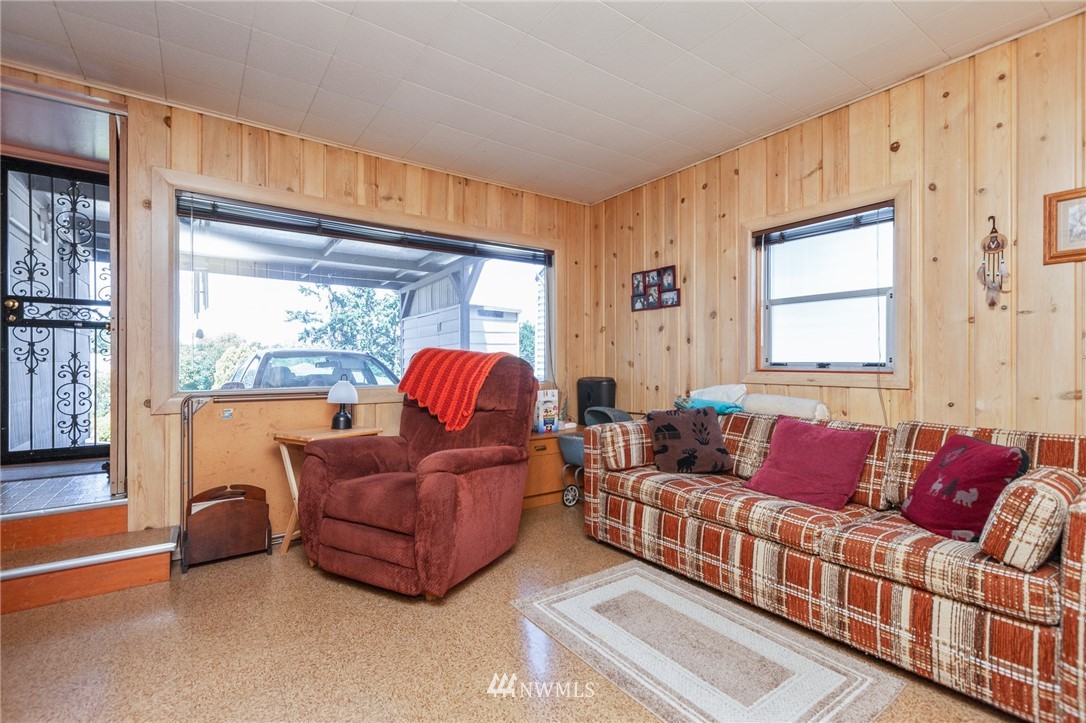 464 Bronson Way Northeast Renton, WA 98056 - Photo 10 of 25 a living room with furniture and a large window