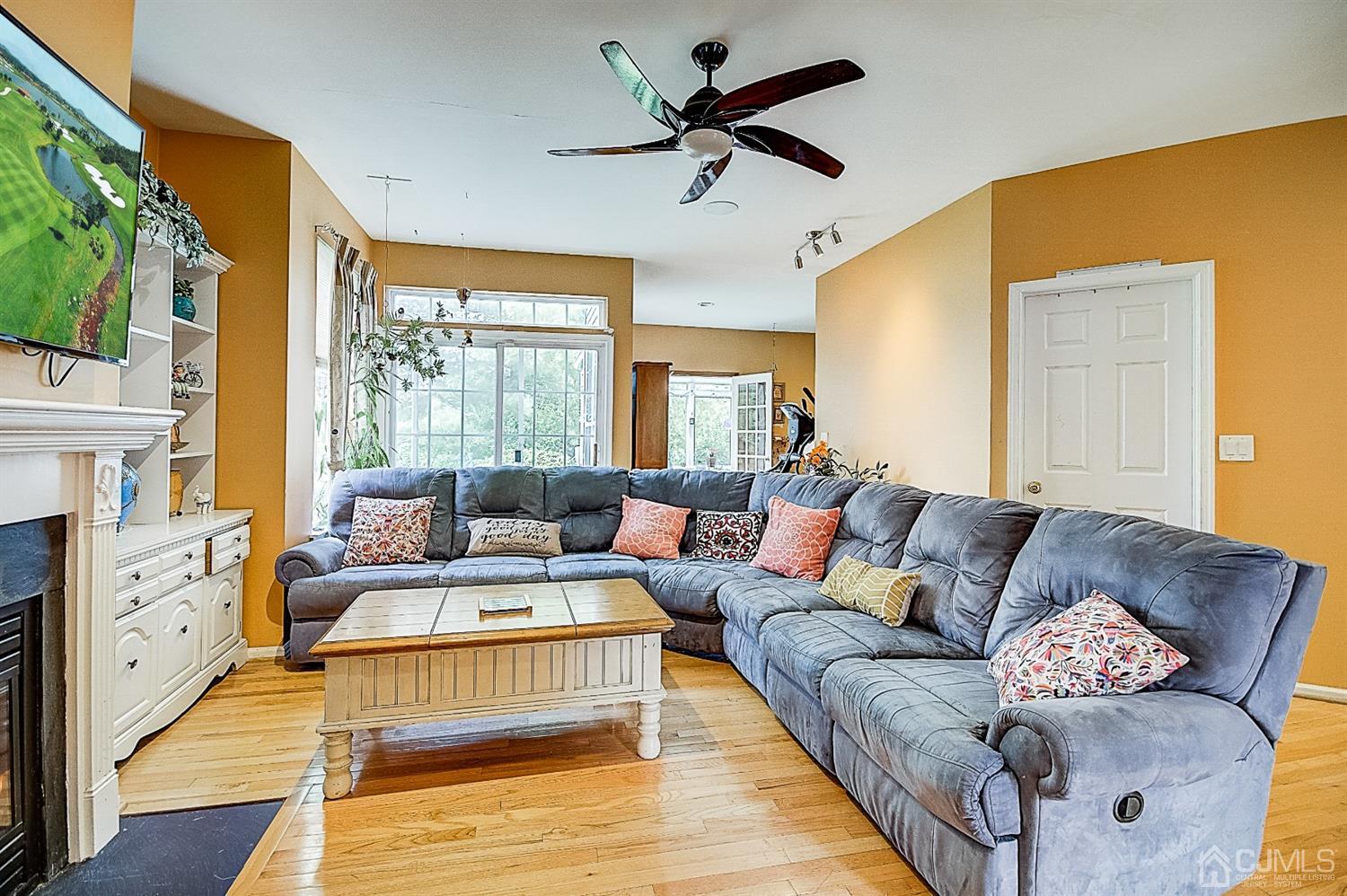 51 Timber Ridge Road North Brunswick, NJ 08902 - Photo 11 of 57 a living room with fireplace furniture and a large window