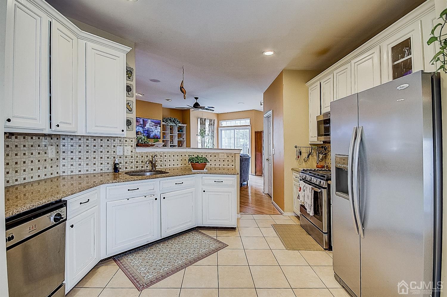 51 Timber Ridge Road North Brunswick, NJ 08902 - Photo 15 of 57 a kitchen with stainless steel appliances granite countertop a refrigerator and a sink