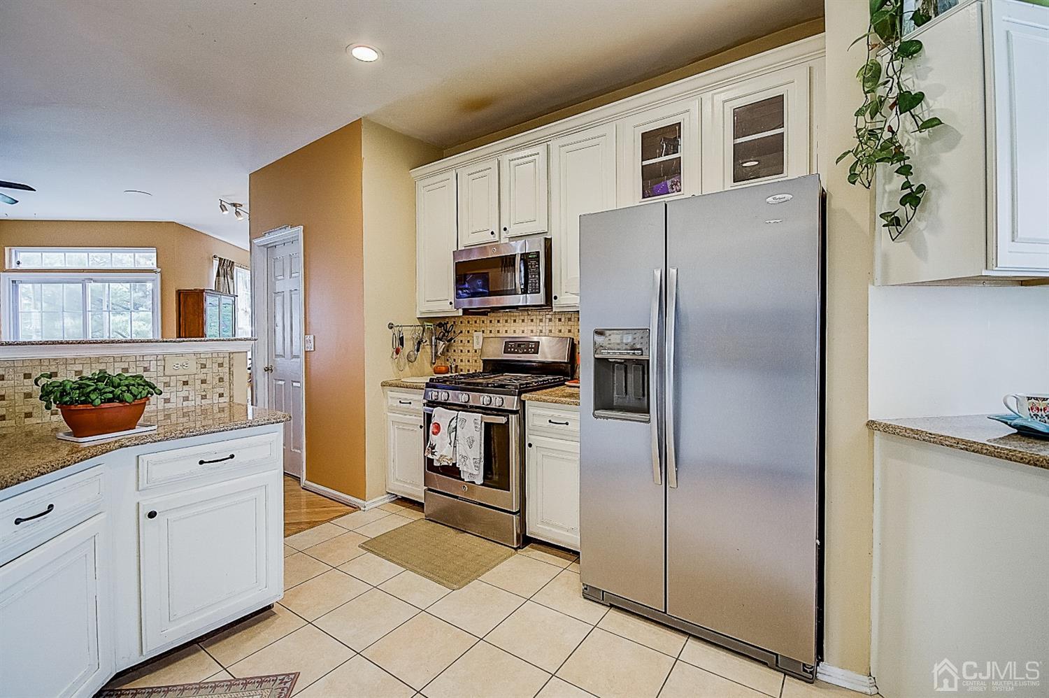 51 Timber Ridge Road North Brunswick, NJ 08902 - Photo 16 of 57 a kitchen with stainless steel appliances a refrigerator sink and microwave