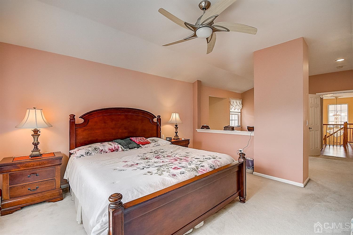 51 Timber Ridge Road North Brunswick, NJ 08902 - Photo 28 of 57 a bedroom with a bed and a chandelier