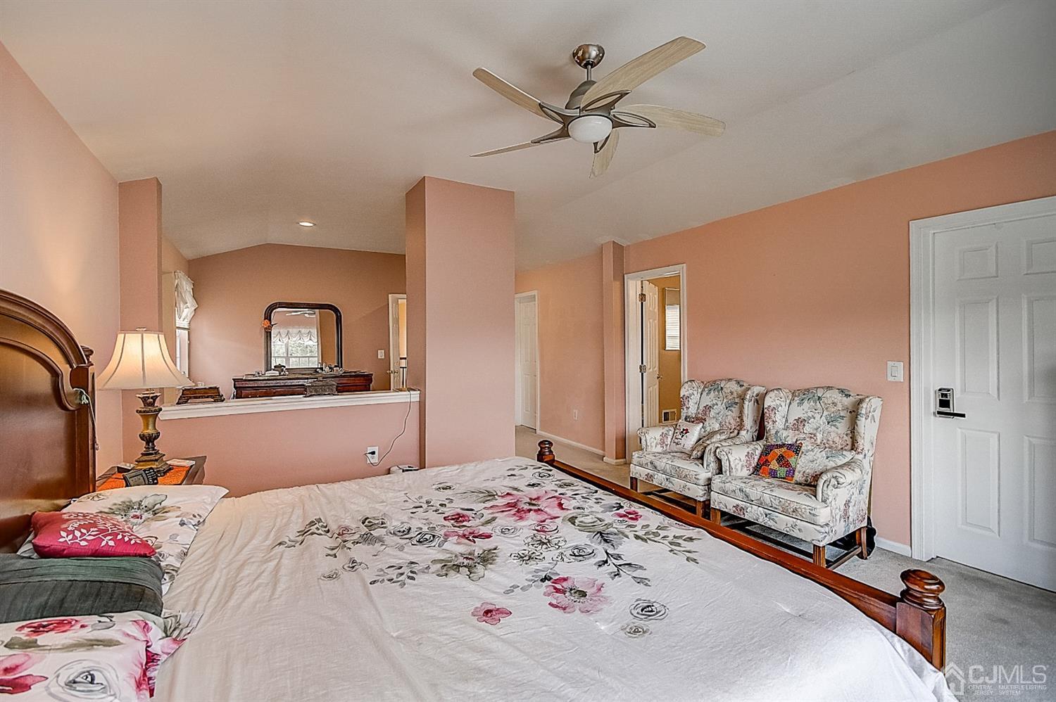 51 Timber Ridge Road North Brunswick, NJ 08902 - Photo 29 of 57 a bedroom with a bed and a large mirror on the dresser