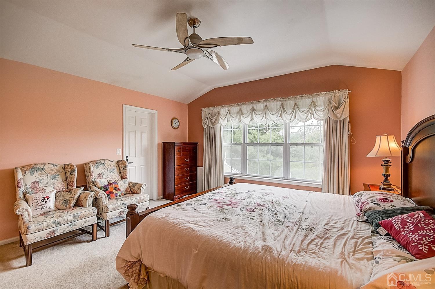 51 Timber Ridge Road North Brunswick, NJ 08902 - Photo 30 of 57 a bedroom with a bed couch and window