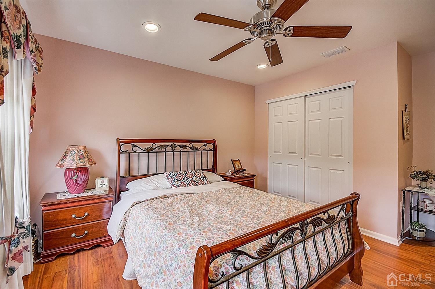 51 Timber Ridge Road North Brunswick, NJ 08902 - Photo 38 of 57 a bedroom with a bed and a chandelier