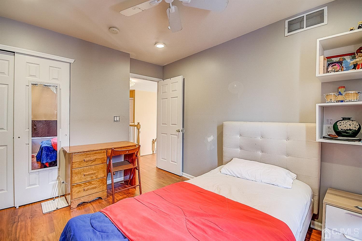 51 Timber Ridge Road North Brunswick, NJ 08902 - Photo 43 of 57 a bedroom with a bed and a closet